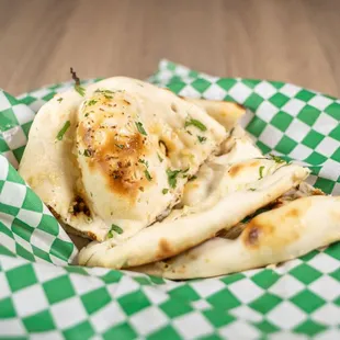a pita with cheese and herbs