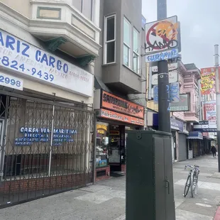 a blue fire hydrant on a city street