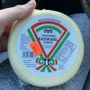 a person holding a cheese