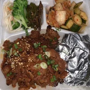 Spicy Pork Bulgogi with white rice and banchan (Korean side dishes)