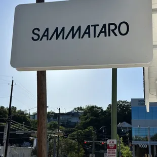a white sign with the word sammatro on it