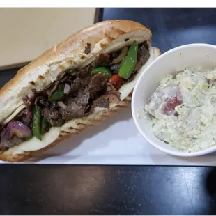 Philly cheesesteak and potato salad