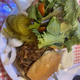 Chopped brisket sandwich with (requested) salad