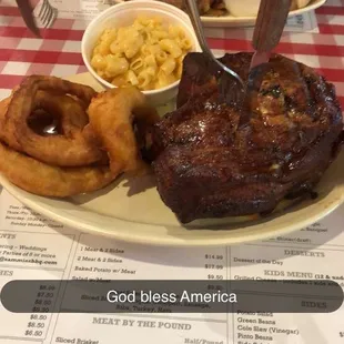 Pork chop, onion rings, Mac and cheese
