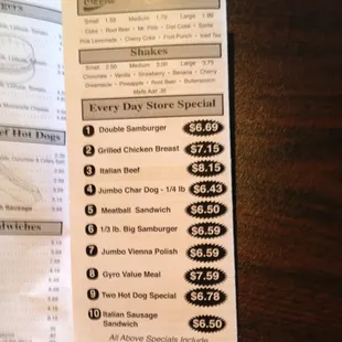 a hand holding a menu for a restaurant