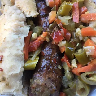 Italian sausage dipped with hot peppers. Look at how nicely this is presented. Not just slapped together and rolled in paper. Yum!
