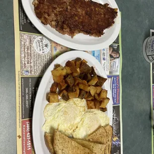 Corn beef, hash, nice and crispy two over easy eggs, potatoes and rye toast best corn beef hash I&apos;ve ever had