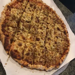 Large hamburger green olive pizza