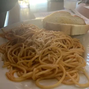 This is a kids spaghetti with a slice of bread they said was possibly garlic toast...