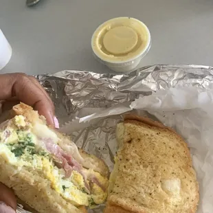 Breakfast sandwich Egg and Cheese with Meat on Garlic Toast