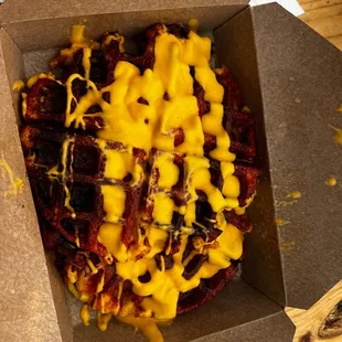 a box of cheese fries