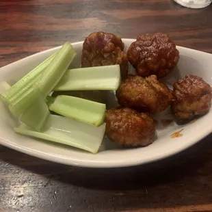 Boneless wings with celery.