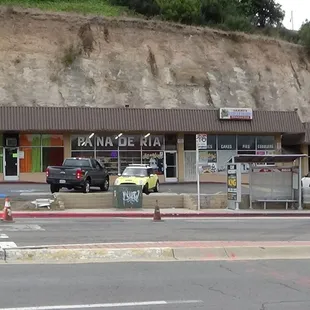 The location of Sammys Bakery just right across from the Encanto Street Trolley .