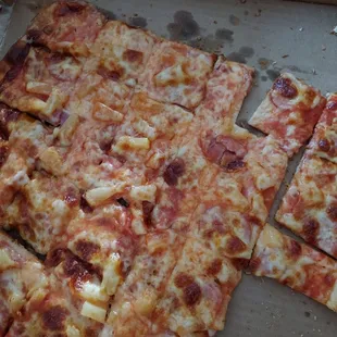 The only time a pizza should be cut into squares is at a buffet or a kids birthday party.