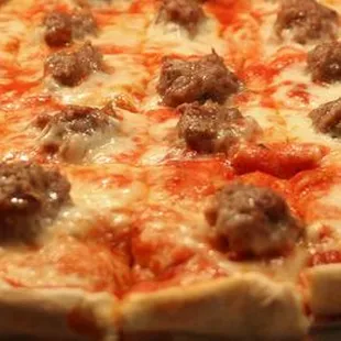 a sausage and cheese pizza