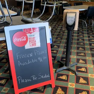 Inside from entrance with frozen pizza advertisement.