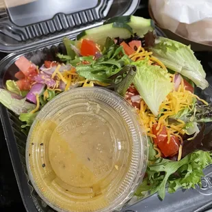 a salad in a plastic container