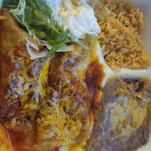 Shrimp enchiladas, rice, and beans