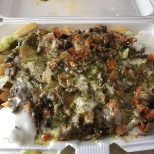 Carne asada fríes a lot of cream but good