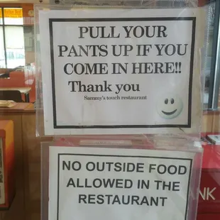 a sign in the window of a restaurant