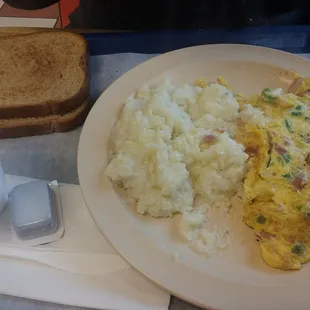 an omelet, mashed potatoes, and toast