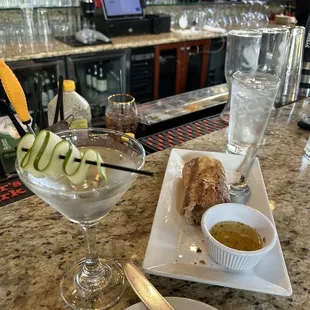 Hendricks Martini with bread and Italian cheese and olive oil dipping sauce