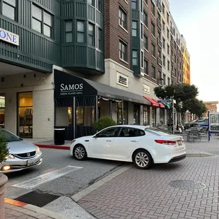 a car parked in front of a restaurant