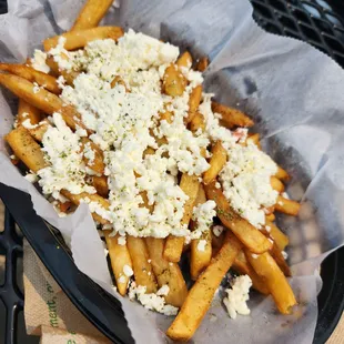 a basket of cheese fries