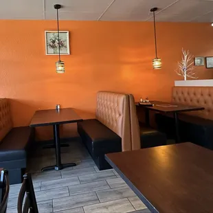 Two types of comfortable seating...booth or table.