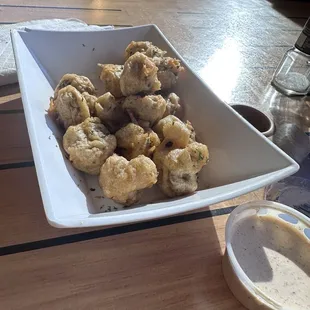 Hand battered mushrooms with spicy ranch type sauce