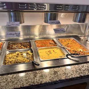 Vegan and vegetarian options for buffet Includes chana masala, yellow daal, cabbage, beans, onion pakora