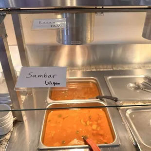 Sambar and rasam in buffet