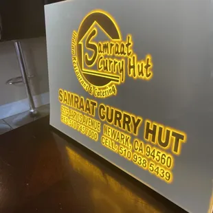 Samraat curry hut sign