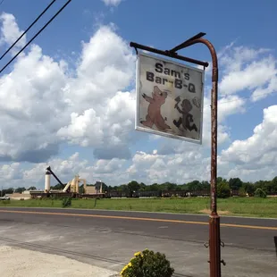 ows a sign on the side of the road