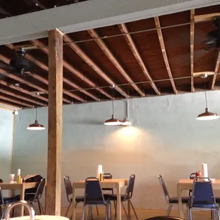 ows tables and chairs in a restaurant