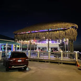 a tiki hut at night
