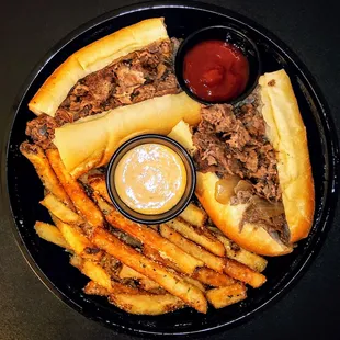 PHILLY CHEESE STEAK: Philly&apos;s finest chip steak on a steak roll, with Sam&apos;s spicy ketchup. $9