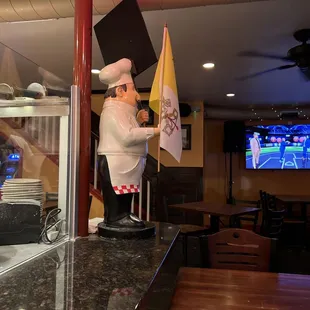 a chef holding a flag