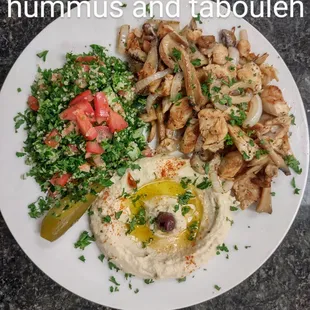 grilled chicken tender with sauteed onion n&apos; mushrooms served with our home recipe of hummus and tabouleh