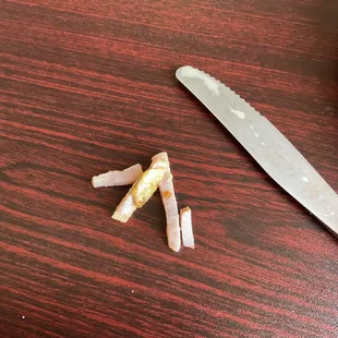 a knife and cigarettes on a table