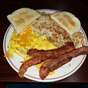 Ham &amp; cheese omelette, hash browns, sourdough toast, side of bacon.