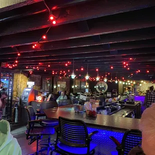 Large L shaped bar with limited booth and high top tables as well.