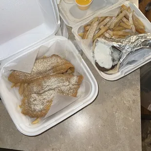 a tray of french fries and an egg