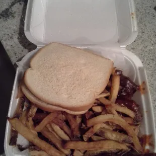 Rib tips buried under fries &amp; the obligatory sliced white bread.