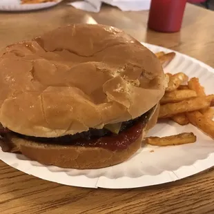 Sam&apos;s bacon cheeseburger. Good taste and all the thumb prints you can handle.