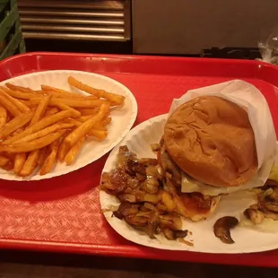 Grilled chicken sandwich with double swiss, also grilled mushrooms, onions and beer battered fries