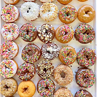 a variety of donuts with sprinkles