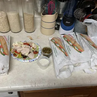 2 Italian Hoagie Subs and 2 Sams Sam's Big Boy Subs plus a turkey salad with ranch and peppers on the side- thanks Sam!