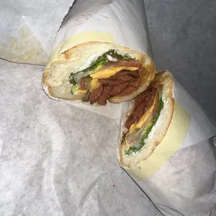 a beef sandwich cut in half