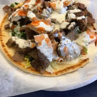 a pita with meat and sauce
